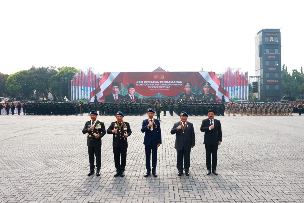 Jokowi and Prabowo Subianto Inspect Troops at Presidential Inauguration Security Ceremony while Riding Together in Pindad Jeep